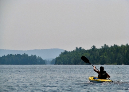 Kayaking teen on Nicatous Lake